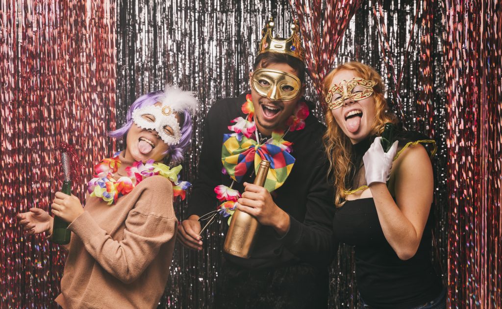 low-angle-smiley-friends-with-costumes-carnival-party